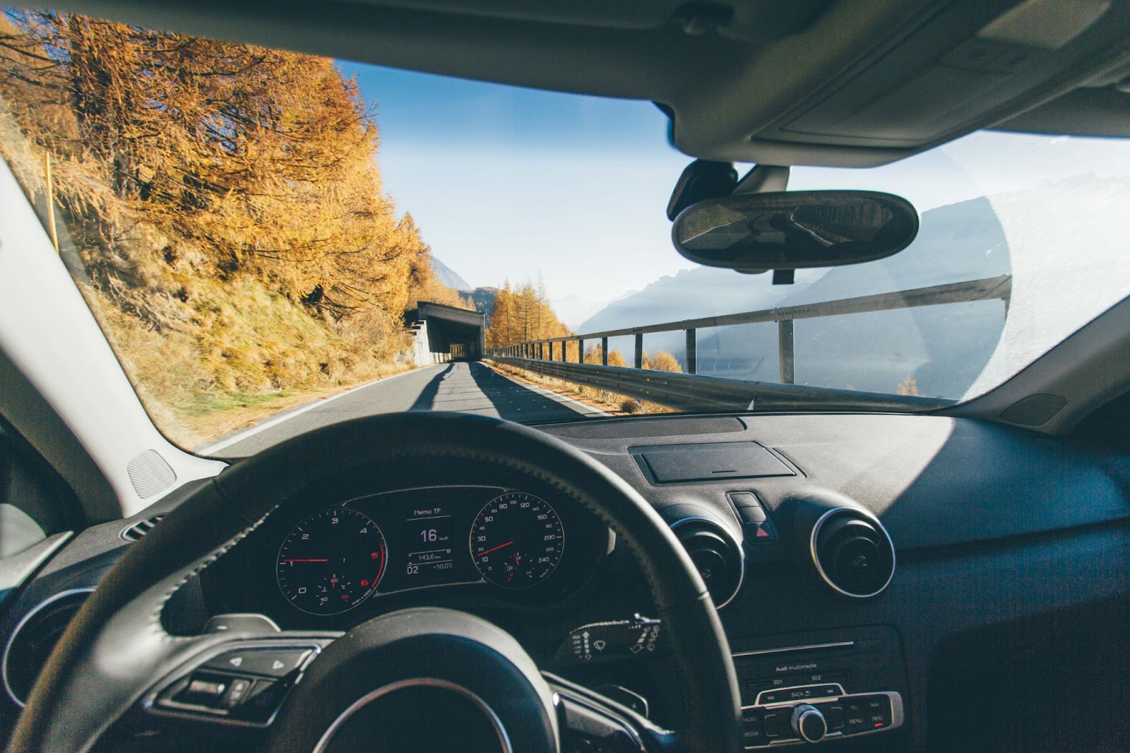 An employee driving to a meeting with a client.