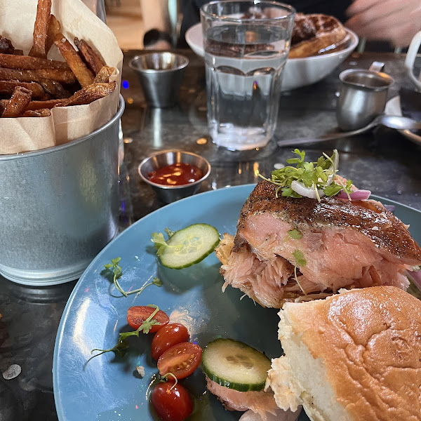 Smoked Salmon Sandwich(Brunch) Udi's Bun. Side of Fries