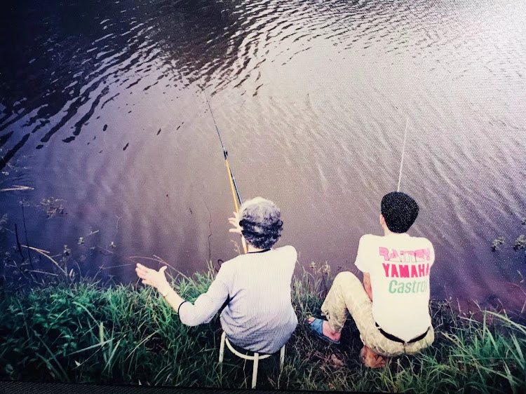 Grandma fishing with dad.