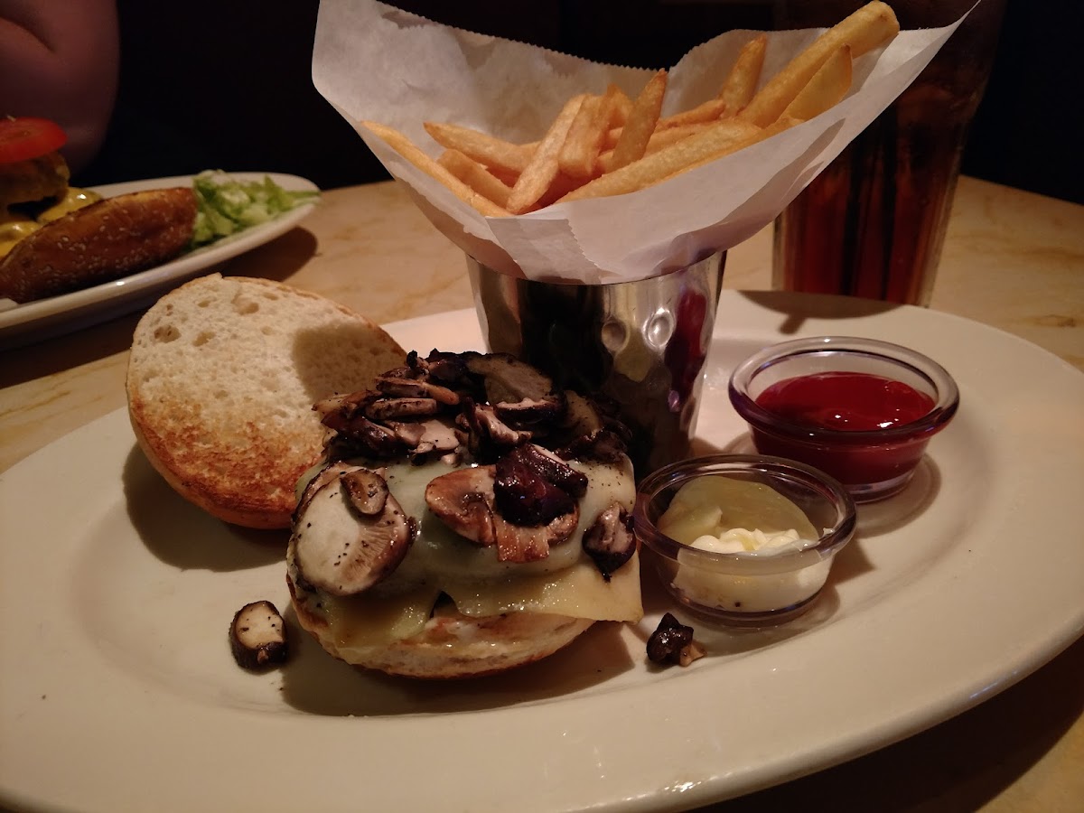 Sauted mushroom and melted Swiss hamburger on a GF bun with mayo. And GF fries!