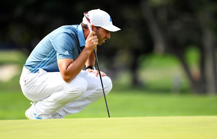 Sergio Garcia looks over a putt