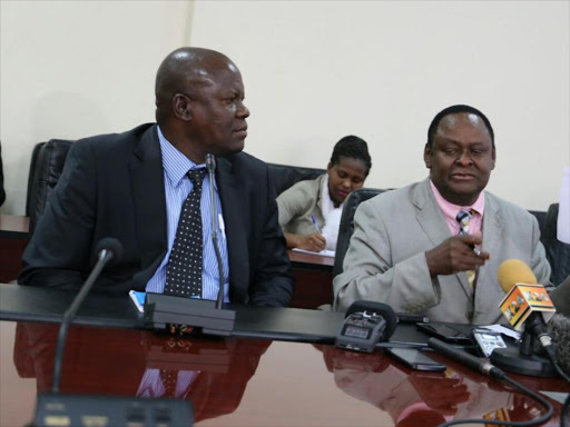 Pumwani Maternity Hospital CEO Omondi Kuba and Nairobi county health executive Bernard Muia address journalists at City Hall on the ongoing doctors' strike, September 15, 2016. /ANNITA SINEI