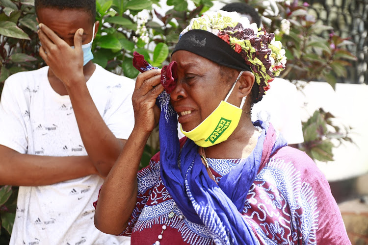 Francina Magati's mother Terezi Mweni and her first born Henry Taura weep at Haki Africa offices on Wednesday.