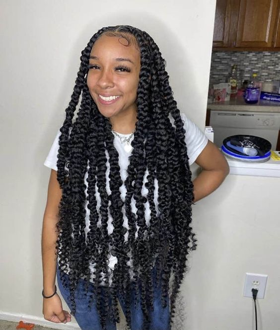 smiling lady wearing knotless butterfly braids