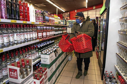 A shopper buying alcohol at in Blue Downs Mall before the ban, Cape Town. Picture: GETTY IMAGES/ROGER SEDRES