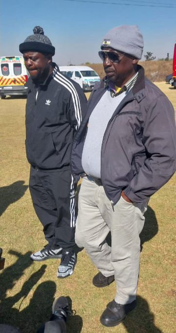 Kholeka Magadla (left), the father of Kholekile Magadla, who fell into a manhole last week, with the family's spokesperson Veli Mthethwa.