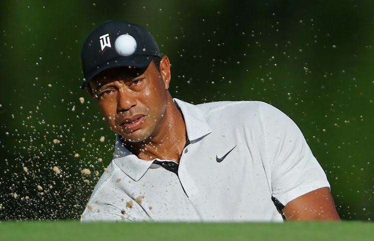 Tiger Woods plays a shot from a bunker during a practice round prior to the start of the 2022 PGA Championship at Southern Hills Country Club in Tulsa, Oklahoma on May 16 2022.