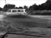 HAZARD: The flooded drainage system poses danger to the residents of Tickeyline. 09/03/09. PIc. Michael Sakuneka. © Sowetan.