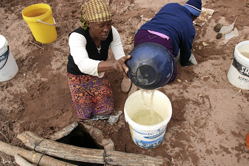 Lisbeth Tapala, fetches water from a hole dug in a dry riverbed in Dipere/Nong village at Bakenberg in Mokopane.