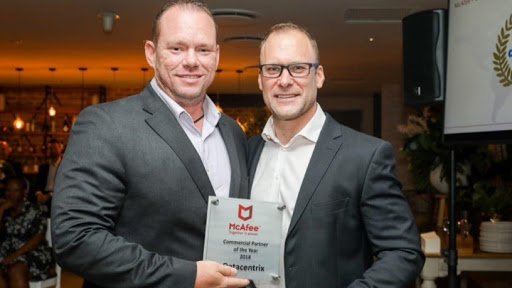 Trevor Coetzee, regional director for sub-Saharan Africa at McAfee (right), congratulates Wayne Olsen, security business unit manager at Datacentrix, on the company's recent win.