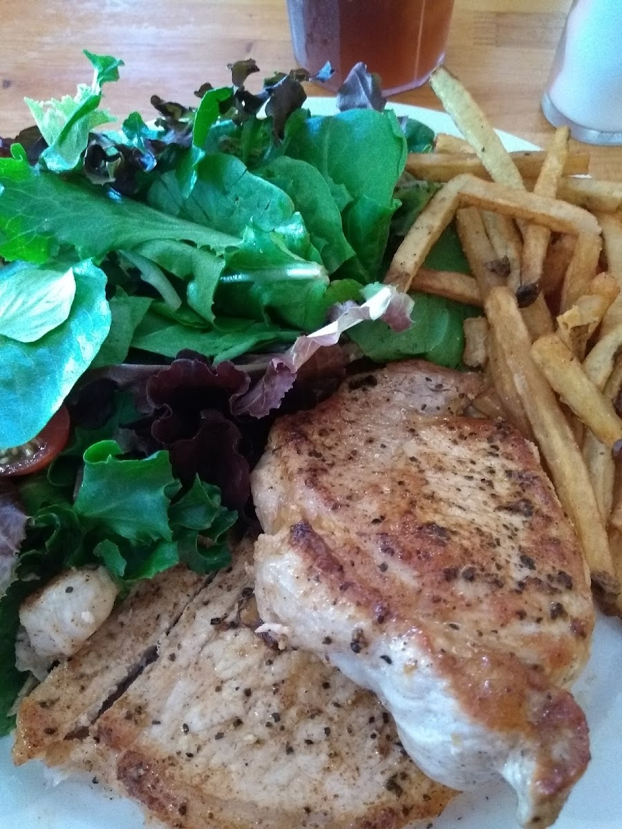 Seared Pork Loin with fries and salad.