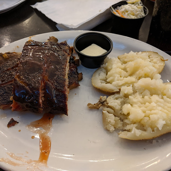 Half rack ribs (missing a rib couldn't control myself) with a side of a baked potato