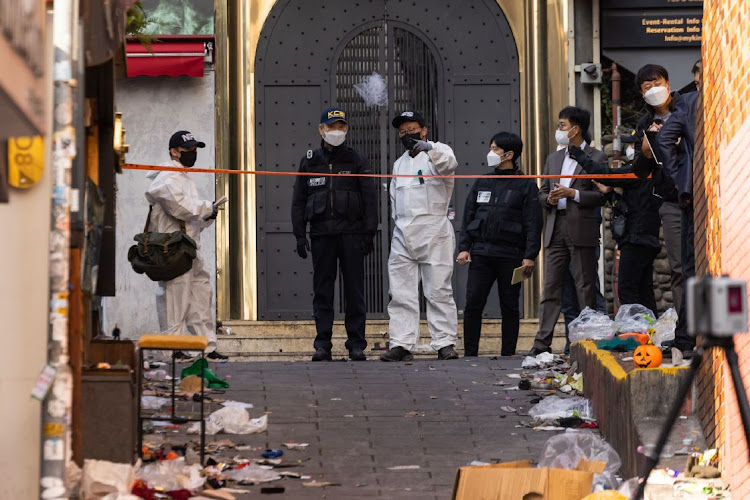 Crime scene and forensic investigators at the site of a deadly crowd crush during Halloween festivities in the Itaewon district of Seoul in South Korea on October 31 2022. File photo.