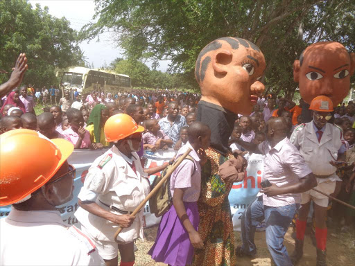 Zangalewa dancers lead hundreds of school children in marking the International Day of the African Child at Matsangoni Primary School, Kilifi, June 16, 2017.