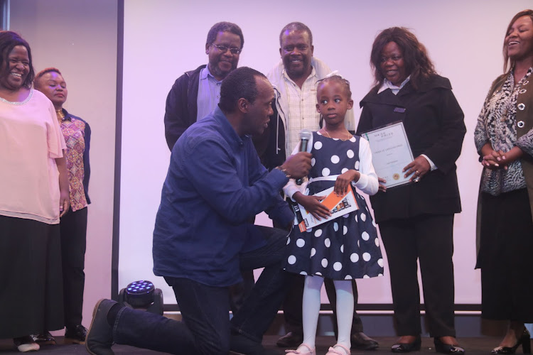 Jeff Koinange with Under 15 category winner Lisa Ndegwa and family.