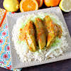 Thumbnail For A Platter Of Crock Pot Citrus Chicken Served Over Cabbage And Rice.