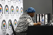 Former ANC MP Vytjie Mentor looks at her phone before the start of her cross-examination at the Zondo commission of inquiry into state capture in Parktown on February 11 2019.