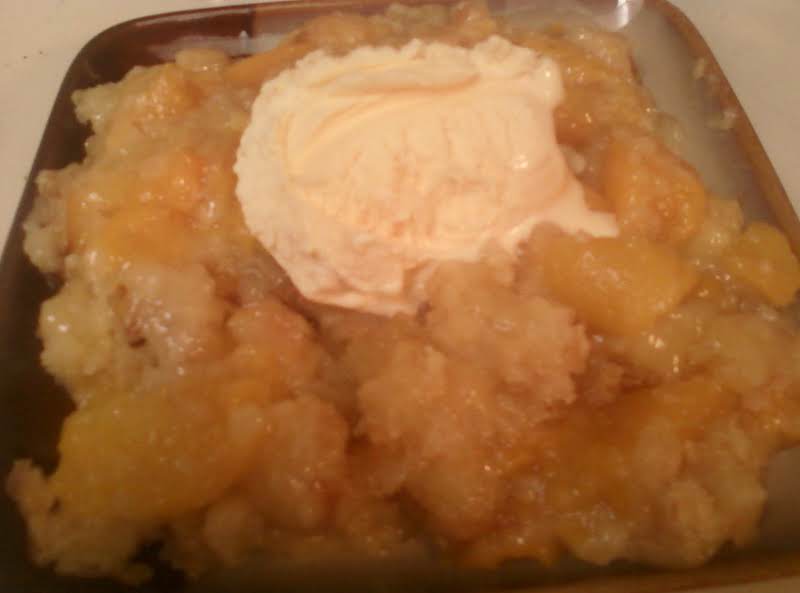 Delicious Home-made Peach Cobbler With A Scoop Of French Vanilla Ice Cream