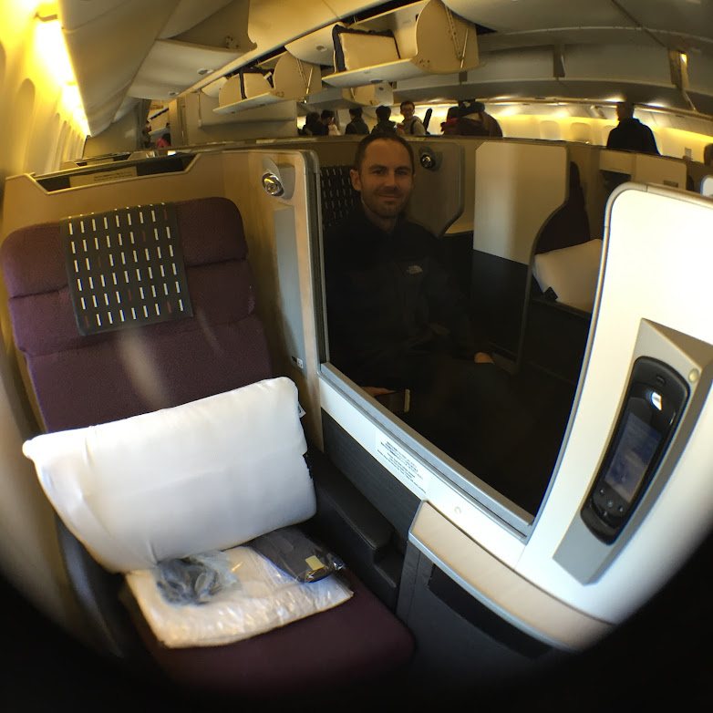 a man sitting in a chair in an airplane