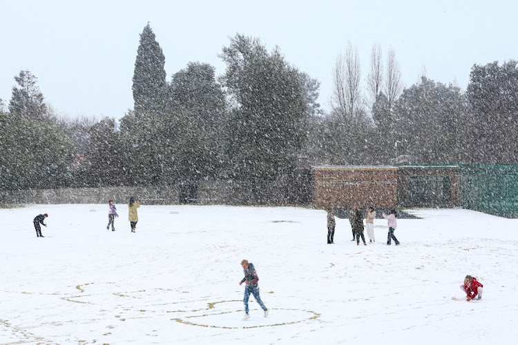 Children play in the snow at Laerskool Orion, in Brackenhurst, Johannesburg, on July 10 2023. Picture: REUTERS/SIPHIWE SIBEKO