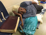 Betty Early, 75, reclines in a school hallway being used as a shelter from Hurricane Michael in Panama City, Florida, US, October 9 2018. REUTERS/Rod Nickel