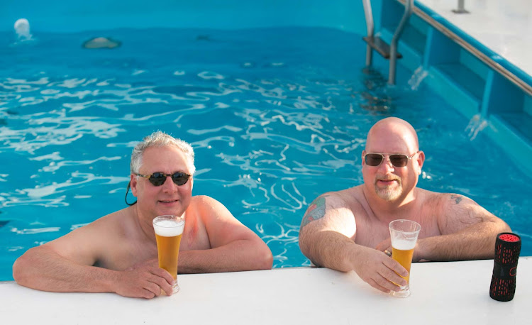 Passengers in the pool on the aft deck of Wind Surf.