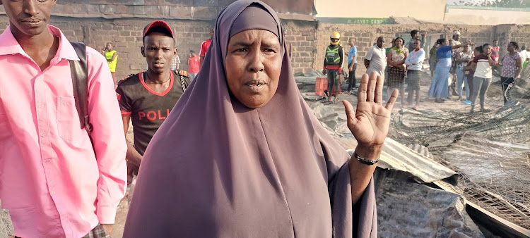 Trader Fatuma Roble who sells groceries at the market speaks to the press on Thursday, June 23.