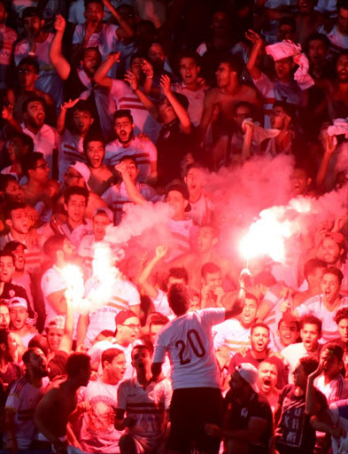 Zamalek's fans cheer during the CAF Champions League stage football match between Egypt's Zamalek and South Africa’s Mamelodi Sundown at Petro Sport stadium, in Cairo, on July 17, 2016.