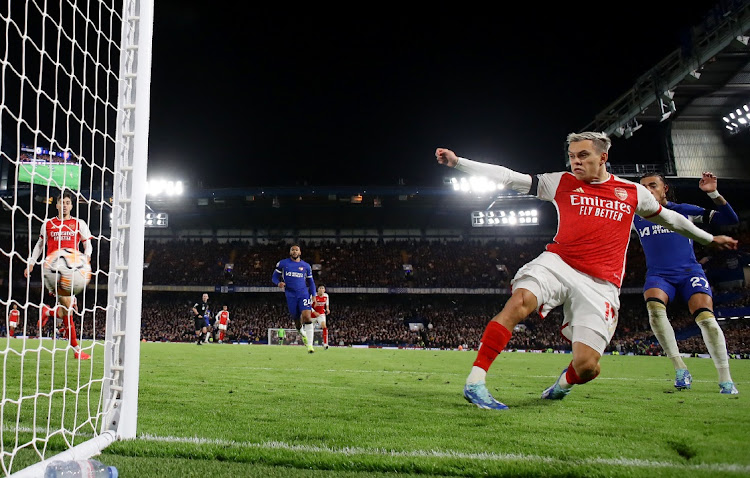 Leandro Trossard scores Arsenal's second goal in their Premier League match against Chelsea at Stamford Bridge in London on Saturday.