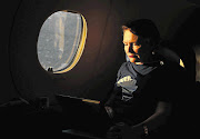 IN FULL FLIGHT: DA leader Helen Zille works on her speech while flying to a party rally in Mthatha.