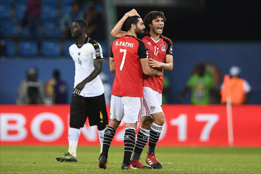 Egypt's defender Ahmed Fathi (L) and Egypt's midfielder Mohamed Elneny celebrate at the end of the 2017 Africa Cup of Nations group D football match between Egypt and Ghana in Port-Gentil on January 25, 2017.