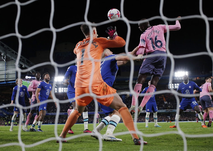 Everton's Abdoulaye Doucoure scores their first goal past Chelsea's Kepa Arrizabalaga in the Premier League match at Stamford Bridge in London on March 18 2023.