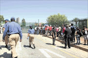 STILL HOPEFUL: Students 
      
       queue outside the University of Johannesburg's Bunting Road campus yesterday to register. 
      PHOTO MOHAU MOFOKENG