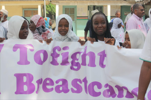 Pupils prepare for a breast cancer walk at Majengo Chief’s camp, Nairobi