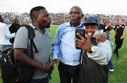 David Thidiela Chairman of Black Leopards celebrates with the fans during the National First Division Promotion and Relegation Playoff match between Black Leopards and Jomo Cosmos at Thohoyandou Stadium on May 30, 2018 in Thohoyandou, South Africa. 