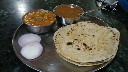 5 Roti + Tasty Choley + Jeera Aloo + Rice + Raita