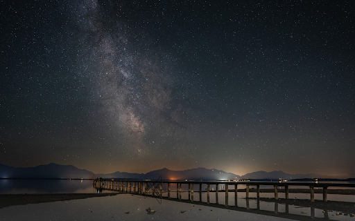 Bridge across the sea at night