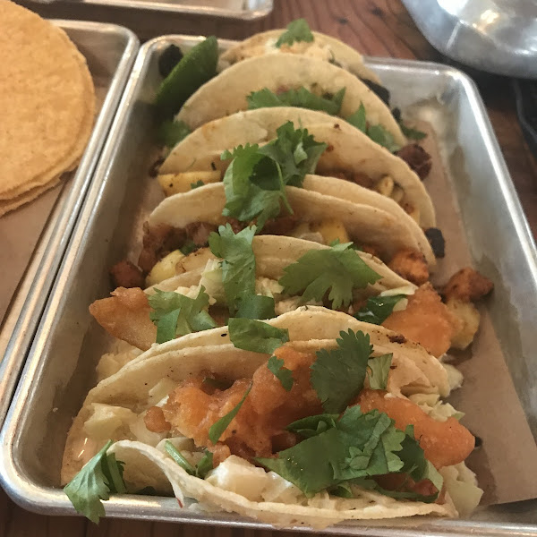 The most amazing fish tacos! The carnitas and the portobello mushroom are also very, very good. The chips and guacamole is interesting and good.  Great atmosphere.  Sit at the bar and take it all in