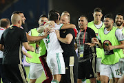 Baghdad Bounedjah of Algeria (c) celebrates goal with coach Djamel Belmadi during the 2019 Africa Cup of Nations Finals Final football match between Senegal and Algeria at the Cairo International Stadium, Cairo, Egypt on 19 July 2019.