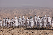 People take part in a nude photo shoot by renowned artist Spencer Tunick close to Arad, Israel. as part of a campaign to raise awareness of the need to preserve the Dead Sea. 