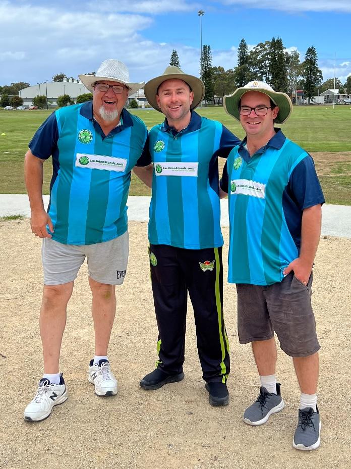 A group of men wearing matching shirts and hats

Description automatically generated