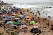 Holidaymakers on Ballito beach in KwaZulu-Natal.