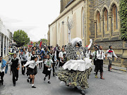 CREATIVE CONSTRUCTION: Rhodes University drama graduate and performance artist Gavin Krastin sweeps the city of Grahamstown away with his work 'The Missus/Misses Series: The Pied Piper Pipe Bomber of 2012'. Children are drawn to this magical, mystical character like iron filings to a magnet