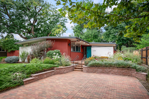 Modern red house with lush garden in this luxury house for sale in Denver ($895,000)