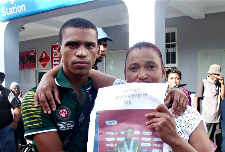 Keenan Groep, with his mother, Heidi Groep, after the Special Olympics World Games in Abu Dhabi,