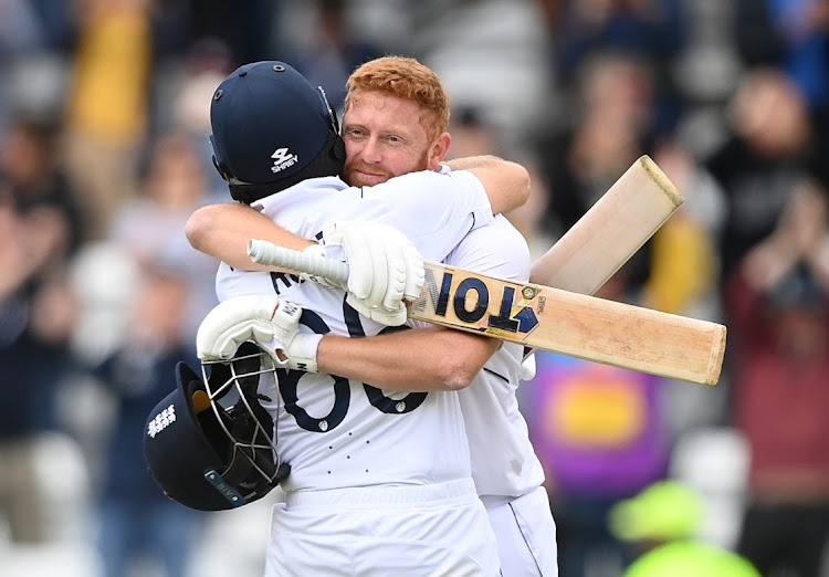 Jonny Bairstow of England celebrates victory with Joe Root in the third Test at Headingley on June 27, 2022 in Leeds