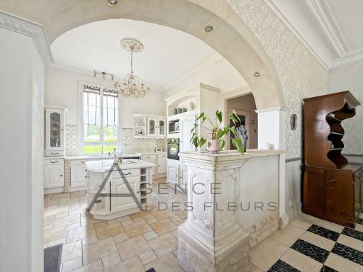 White kitchen with central island - Property purchase in La Saussaye, 12 rooms, 7 bedrooms