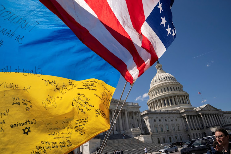 Flags flutter as pro-Ukrainian supporters demonstrate outside the US Capitol in Washington, the US, April 20 2024. Picture: Reuters/Ken Cedeno