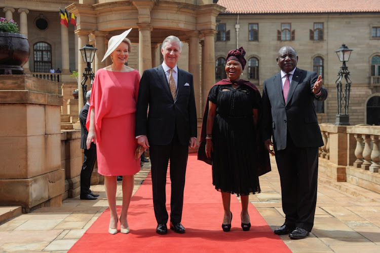 Belgium's Queen Mathilde, King Philippe, South African social development minister Lindiwe Zulu and President Cyril Ramaphosa pose for a photograph during the Belgian royal couple's state visit at the Union Buildings in Pretoria.