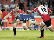 Juan de Jongh of the Stormers gets tackled  during the Super Rugby match against the Lions at Ellis Park on Saturday. PHOTO: DUIF DU TOIT/GALLO IMAGES